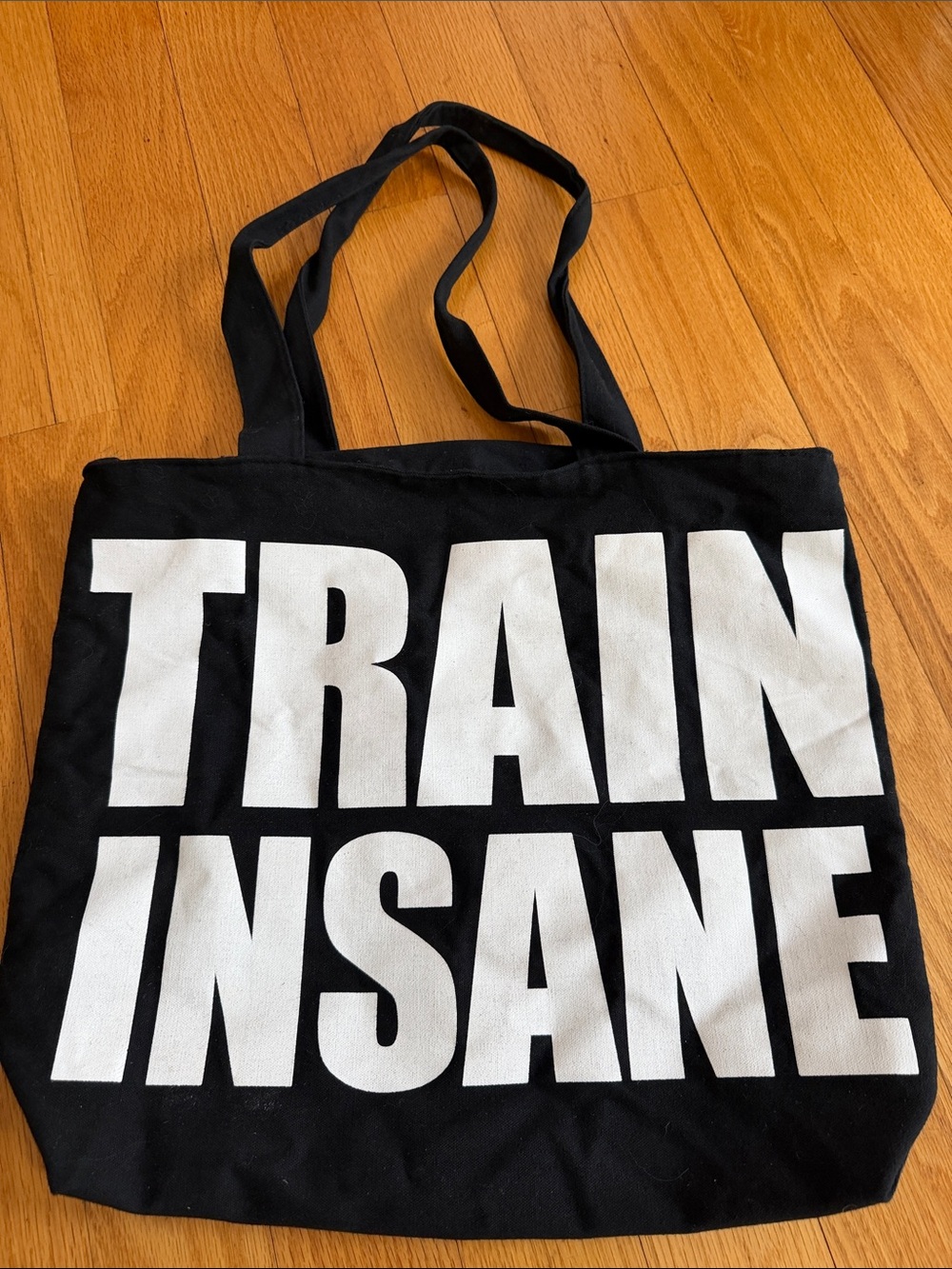 Black Canvas Tote with Bold White "TRAIN INSANE" Print